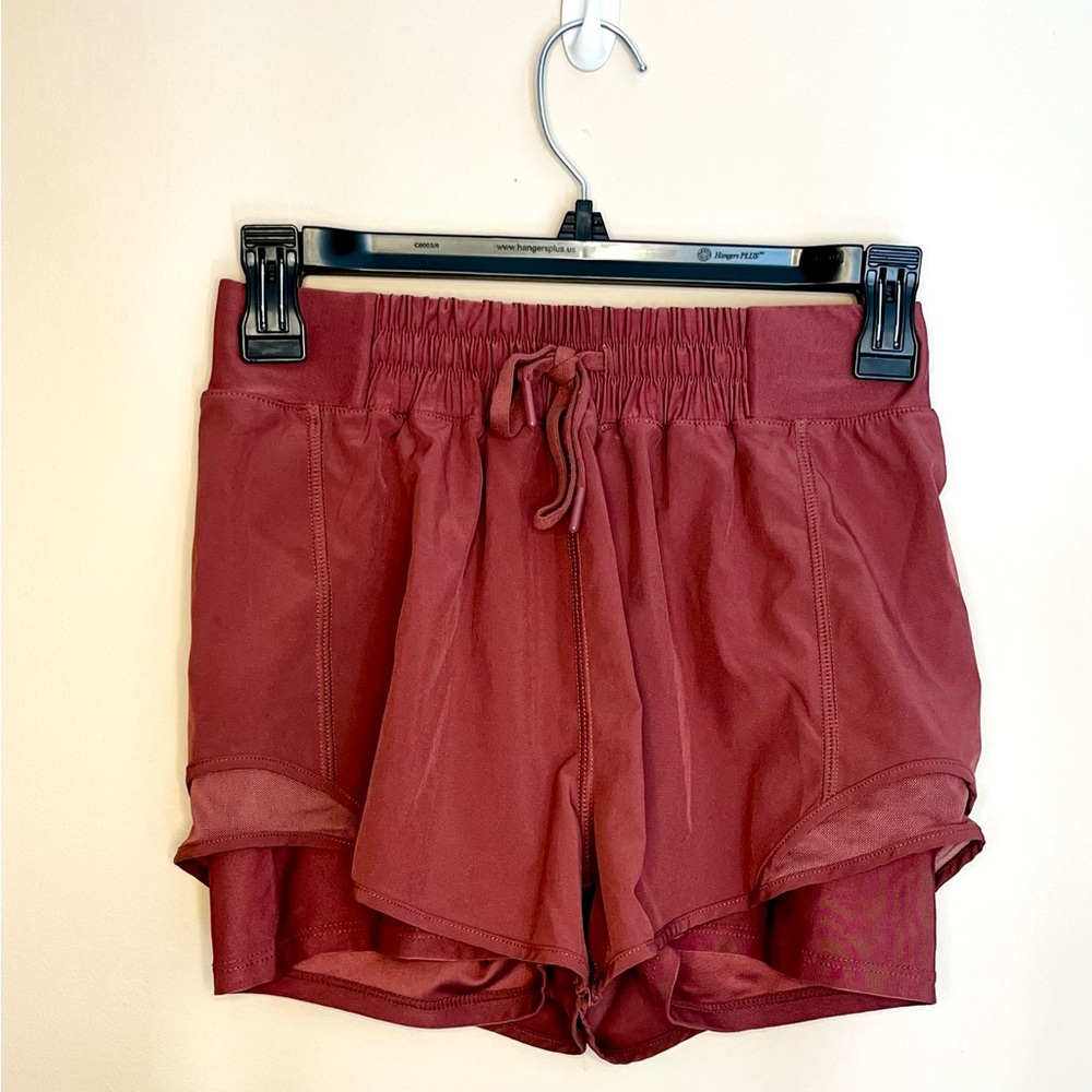 Athletic shorts, maroon, xs-s. Shorts underneath with adjustable waists.